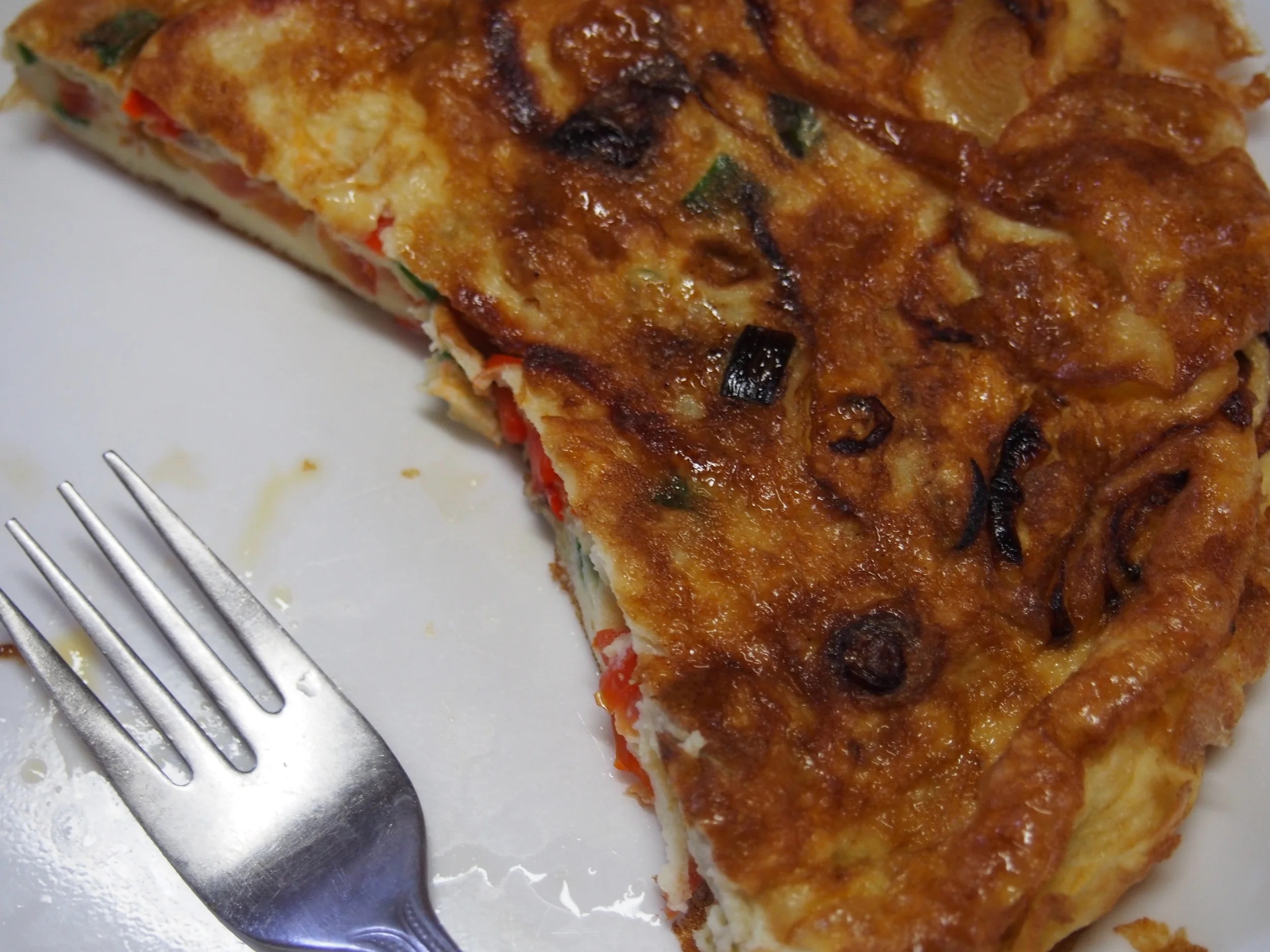 Breakfast = omelette with pimentos, onions, tomatoes